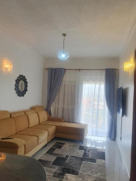 Two Bedrooms Apartment, located between kajjansi and kitende, with one bathroom, a living room, fully furnished kitchen, patio, free wifi, free parking space, Đặt Căn hộ Kajansi Busiiro